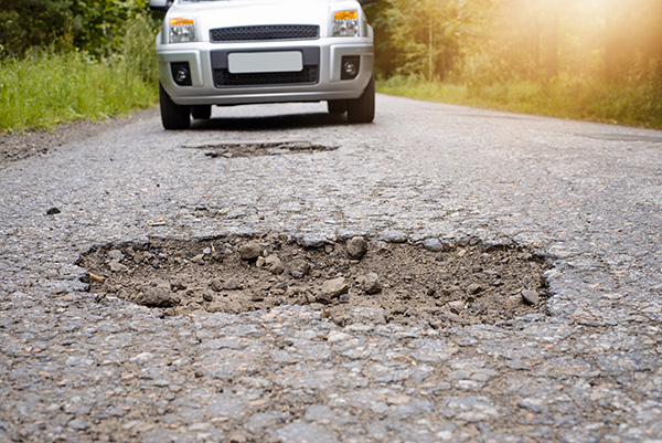 Winter Suspension and Alignment Problems: How Potholes and Ice Ruts Throw Your Car Off