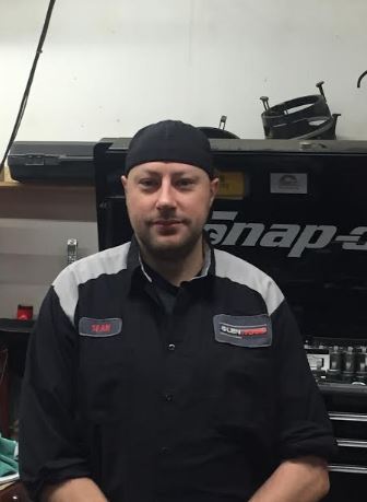 Glenwood Auto Service team member in the headlights - Sean Hill - Foreman at Glenwood